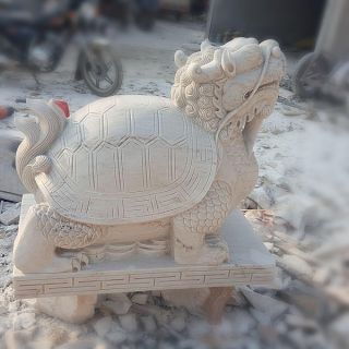 晚霞紅風水龍龜石雕是怎么制作出來的?