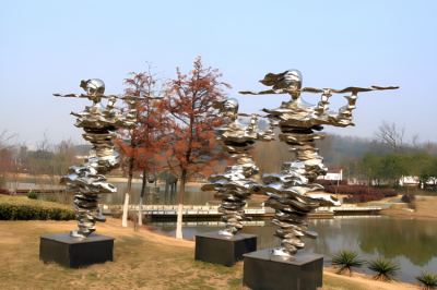 戶外景區不銹鋼抽象吹笛子的人物雕塑